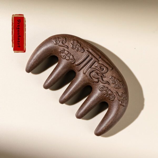 The massage comb with ornate carvings and Fu patterns is designed for scalp care and hair loss prevention, incorporating the benefits of traditional Chinese herbal medicine.