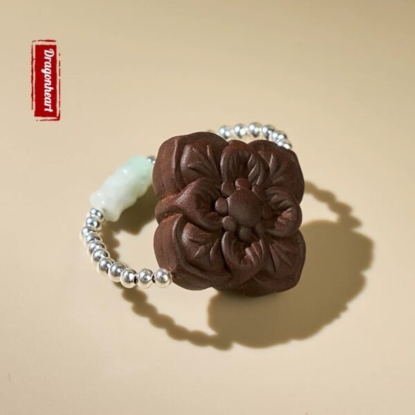 Wooden flower bracelet with silver beads.