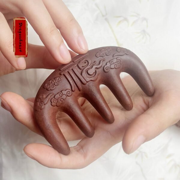 Dragonheart Chinese medicine massage comb, with a blessing pattern on the comb.