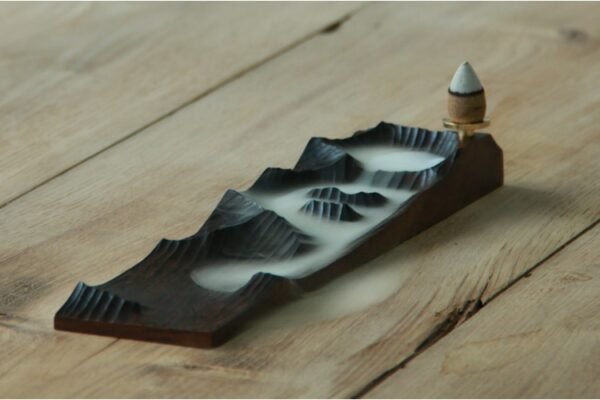 Wooden TCM incense burner, backflow smoke—herbal calm.