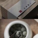 Wooden box and herbal balls with chopsticks.