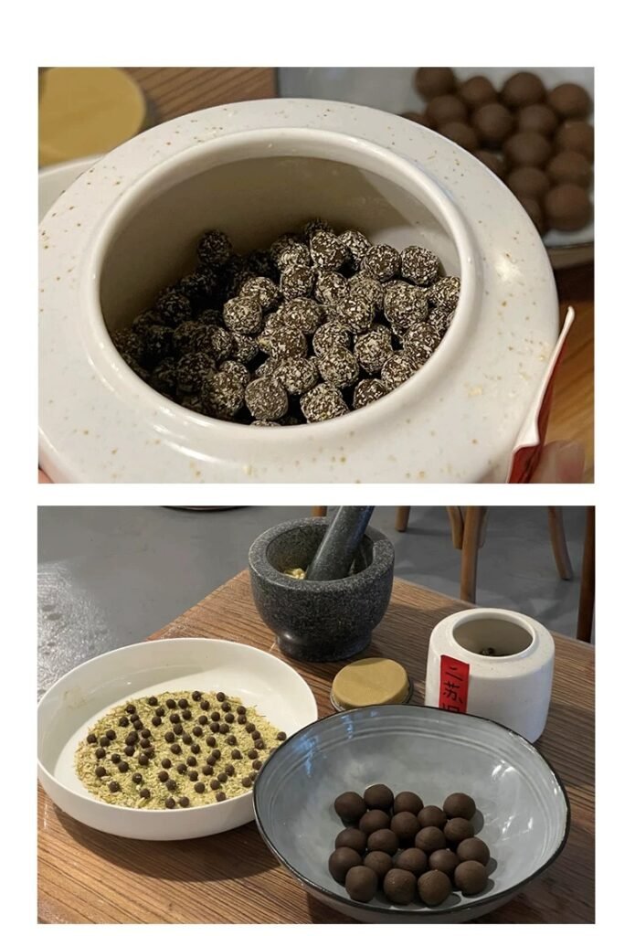 Herbal pills in bowls, mortar, TCM preparation—herbal wellness.
