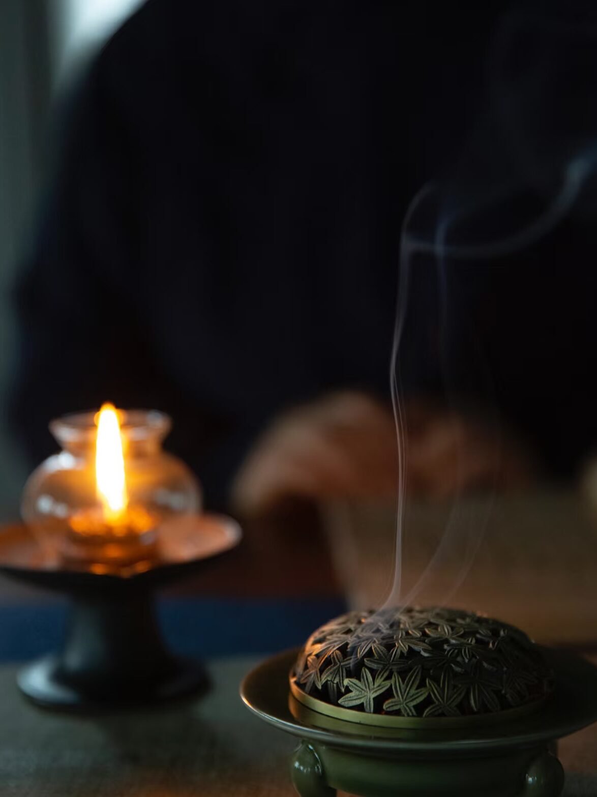Lit Candle and Incense Burner Meditative Scene