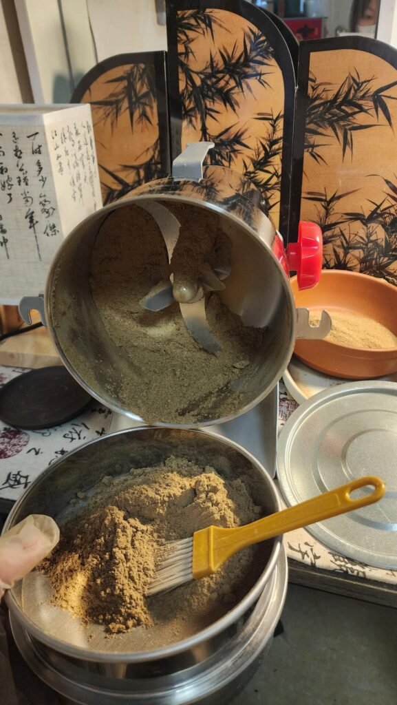 Grinding herbs into powder
