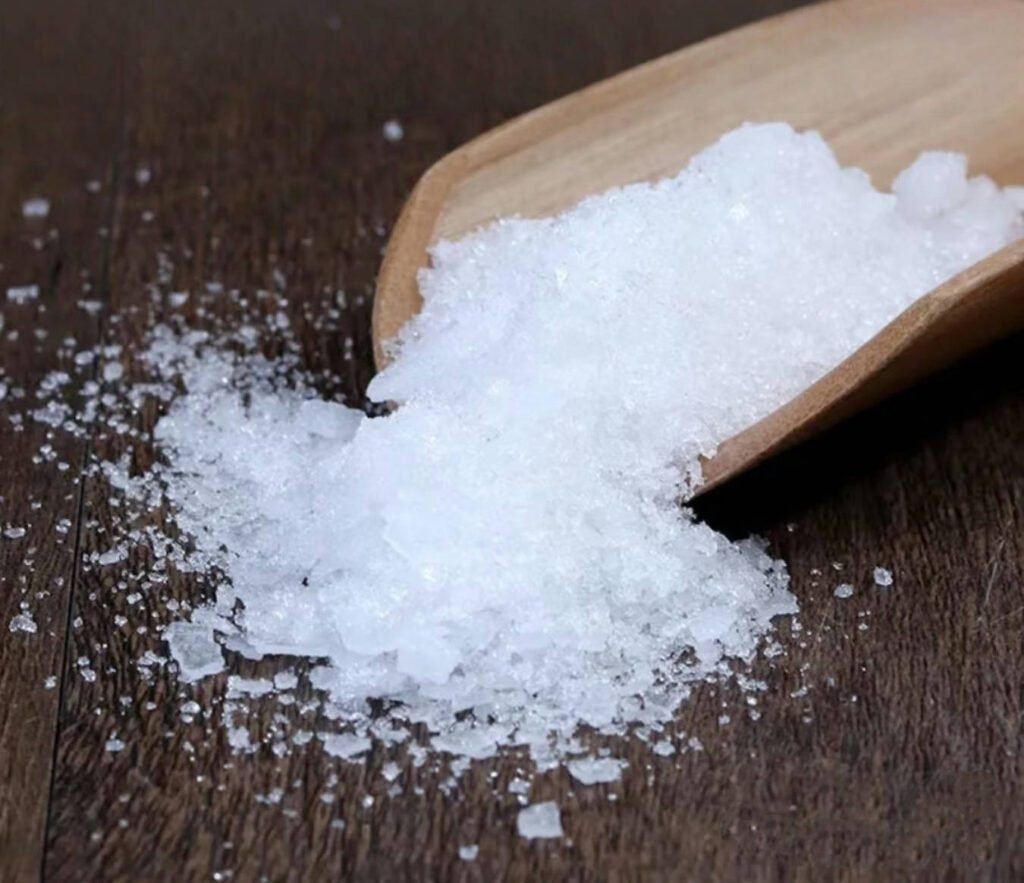 Natural Borneol Crystals Spilled from Wooden Scoop